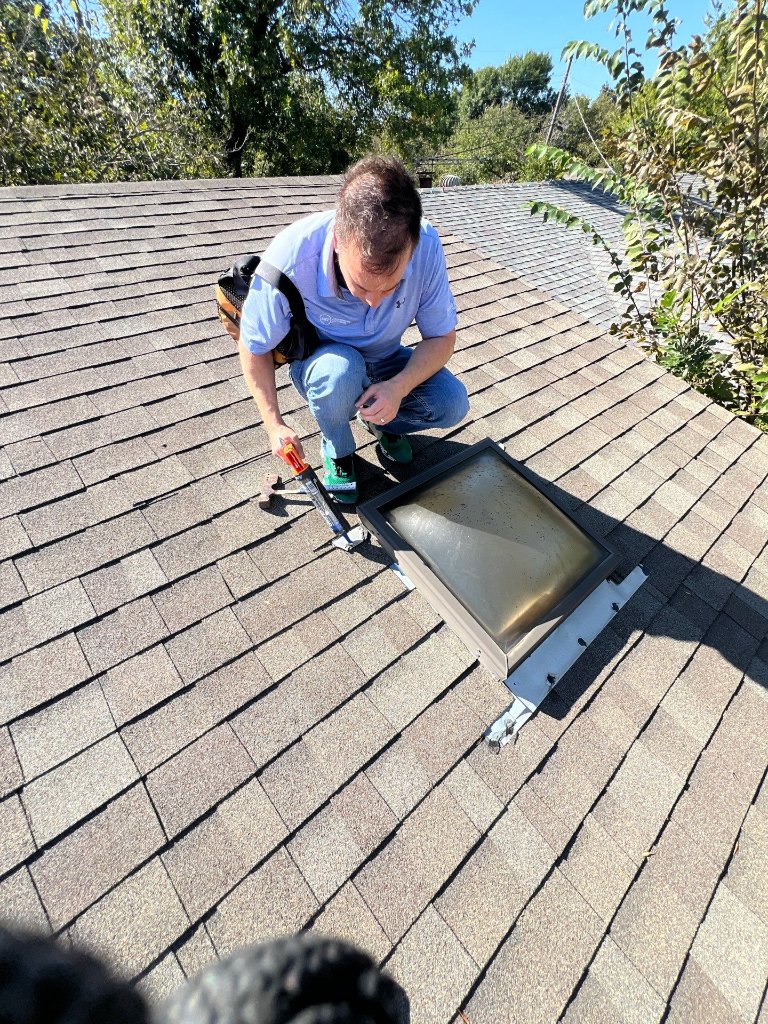 Roofer sealing exposed nails during a wind damage repair on an Arlington, TX roof by Becker Roofing and Exteriors