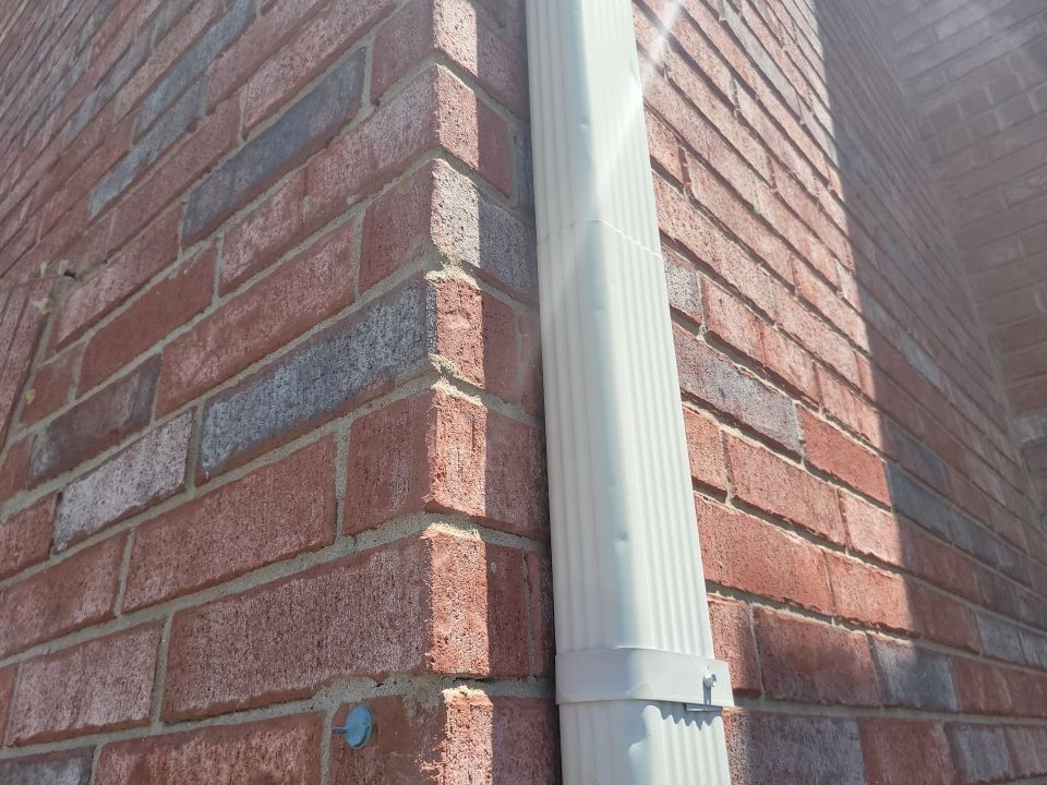 Roanoke Seamless Aluminum Downspout Installation Brick Home Becker Roofing - Roanoke Roofing project photo by Becker Roofing and Exteriors