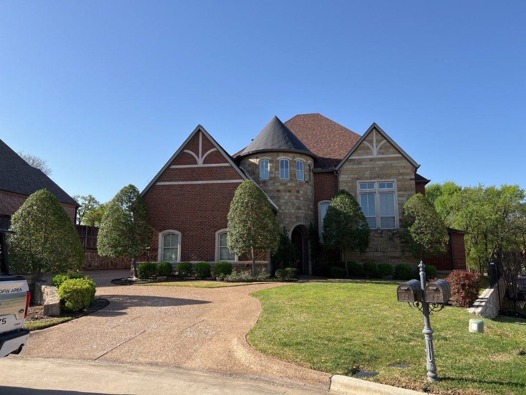Trophy Club Brick Stone Two Story Home New Roof Curb Appeal Becker Roofing - Trophy Club Roofing project photo by Becker Roofing and Exteriors