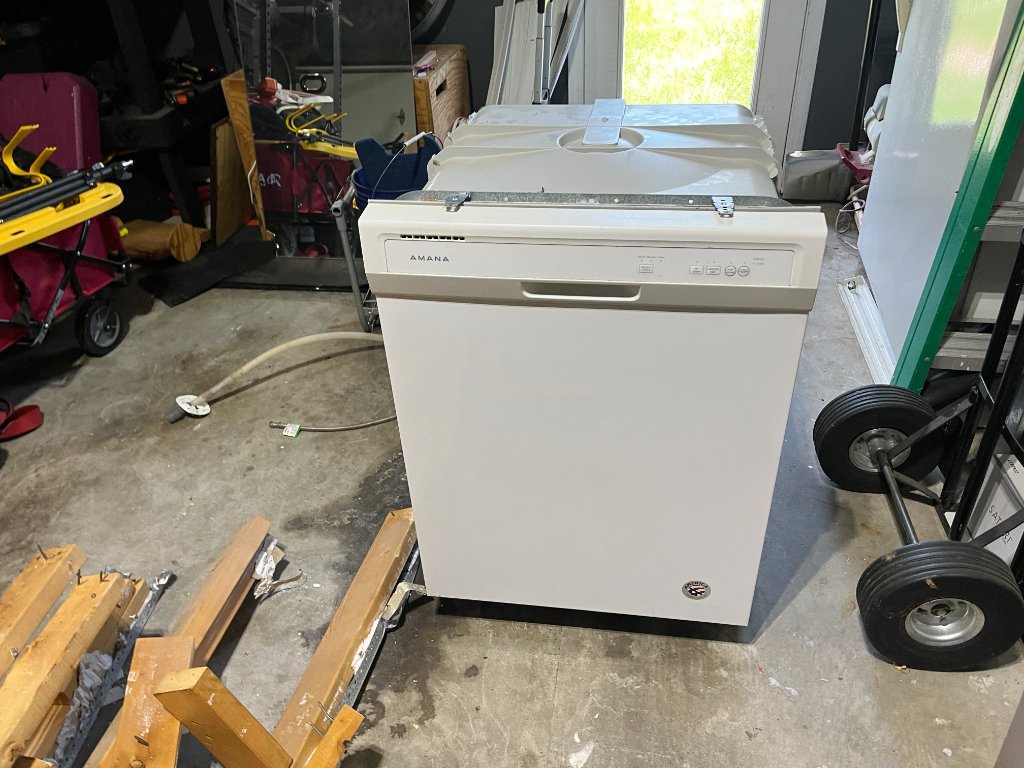 Appliance sitting in garage ready for removal