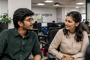 Sanatan in conversation with a colleague
