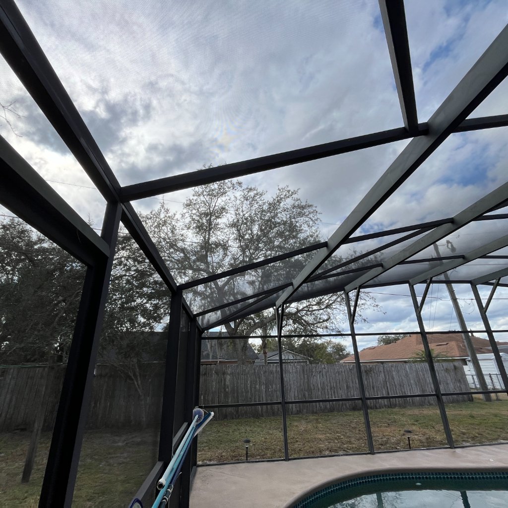 Patio rescreen roof screen replacement on pool cage in Ormond Beach, FL
