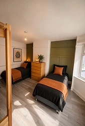 Warmly styled twin bedroom