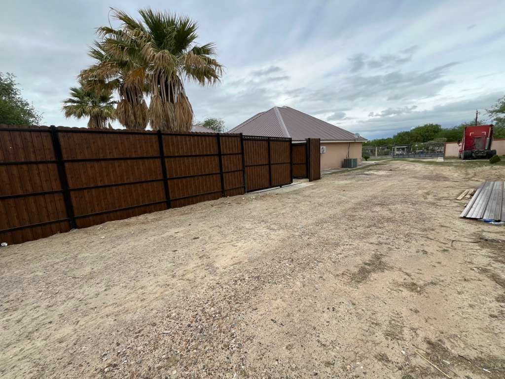 Wood-grain metal fence installation