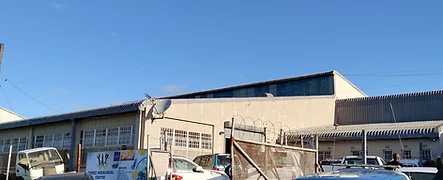 The OCHIEZ entrance, business signage and parked vehicles