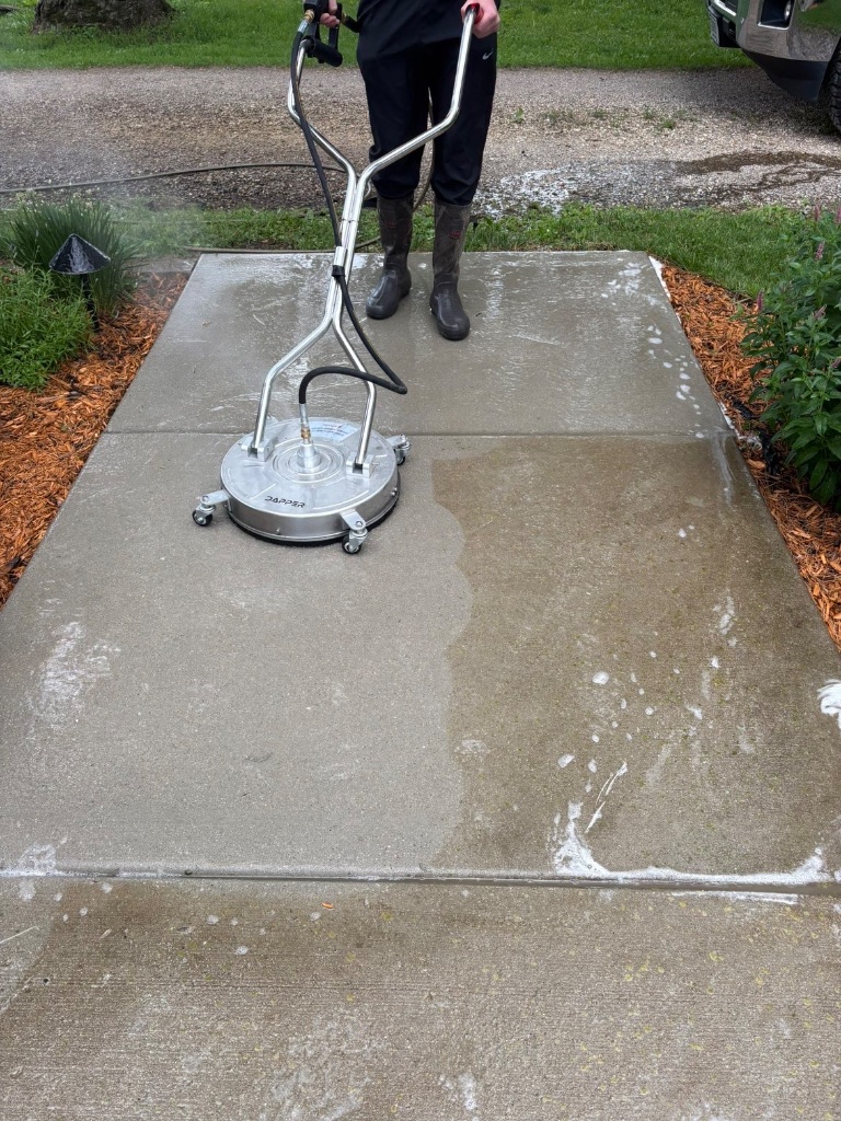 Commercial surface cleaner restoring a concrete walkway
