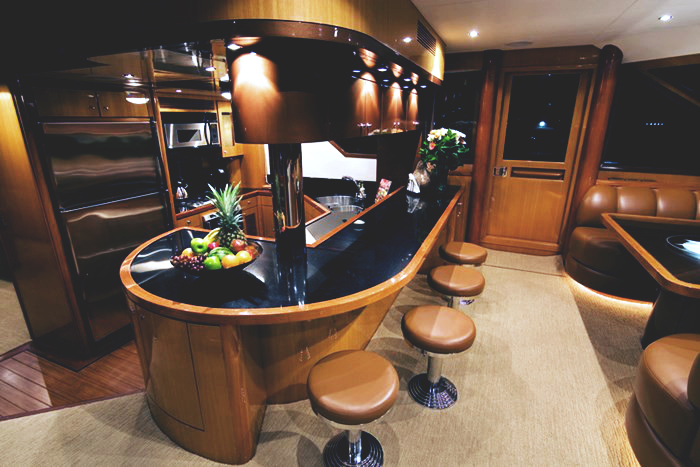 Galley bar — granite counters and teak cabinetry