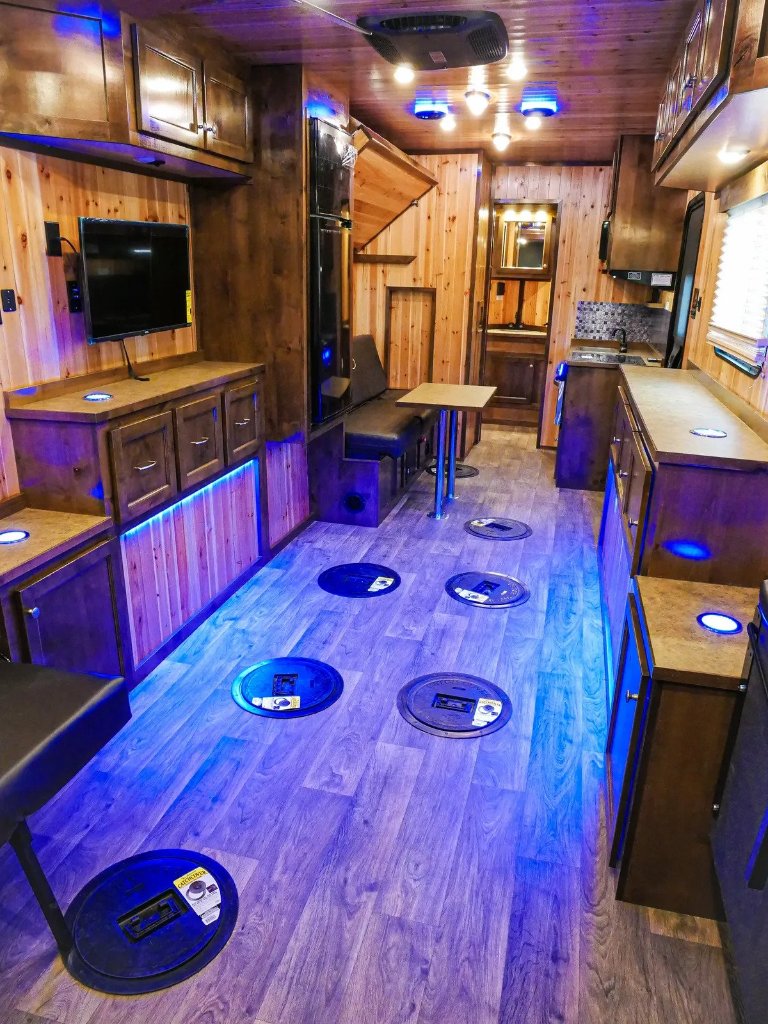 Premium fish house interior with blue lighting and custom cabinetry