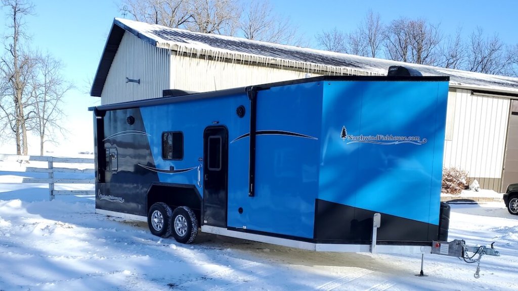 Blue and black fish house in winter