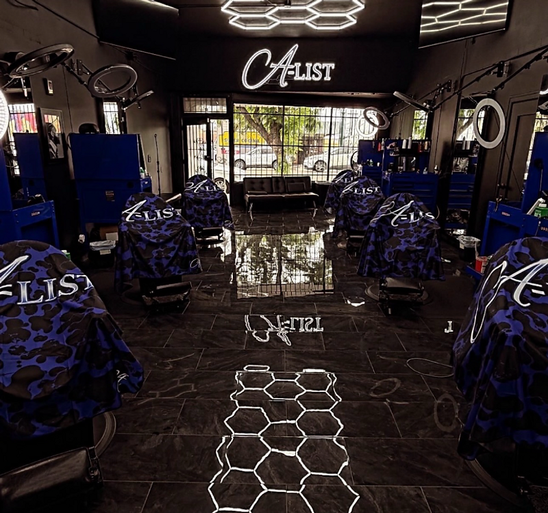 A-List Barbershop luxury interior with hexagon ceiling lights and blue stations
