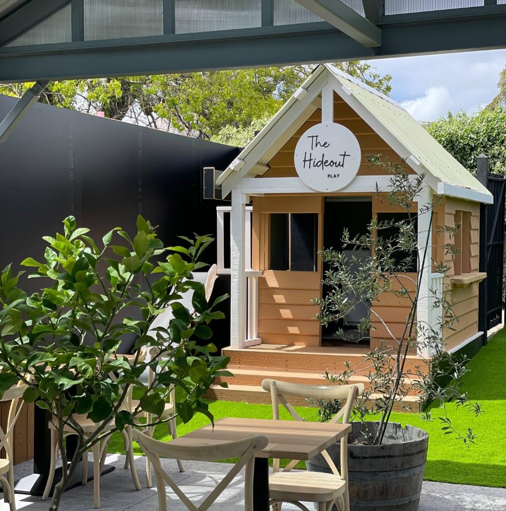 Kids play area with custom cubby house at The Hideout family café Rosebud