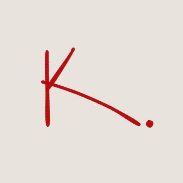 K.