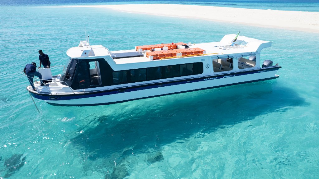 Boat cruising on deep blue ocean
