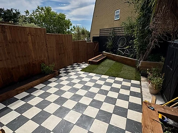 The Checkerboard Court — Marble-effect Porcelain · Raised Beds by Rubin Constructions Ltd