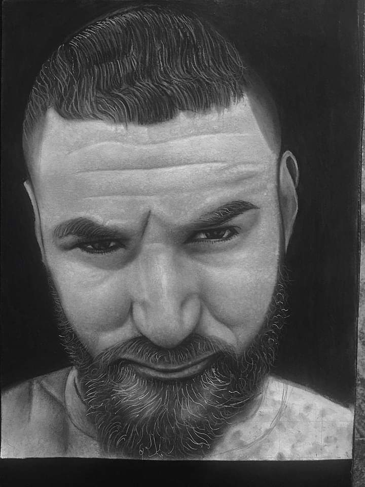 Hyper-realistic graphite portrait with water droplets on skin, demonstrating extraordinary detail