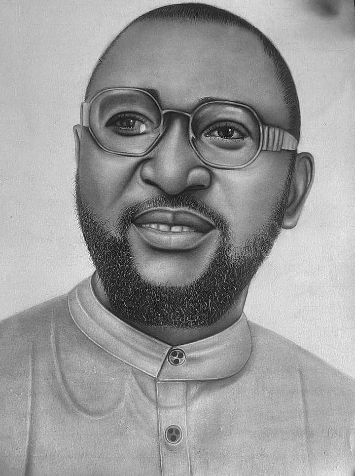 A distinguished portrait featuring a man in glasses with a warm, knowing expression.