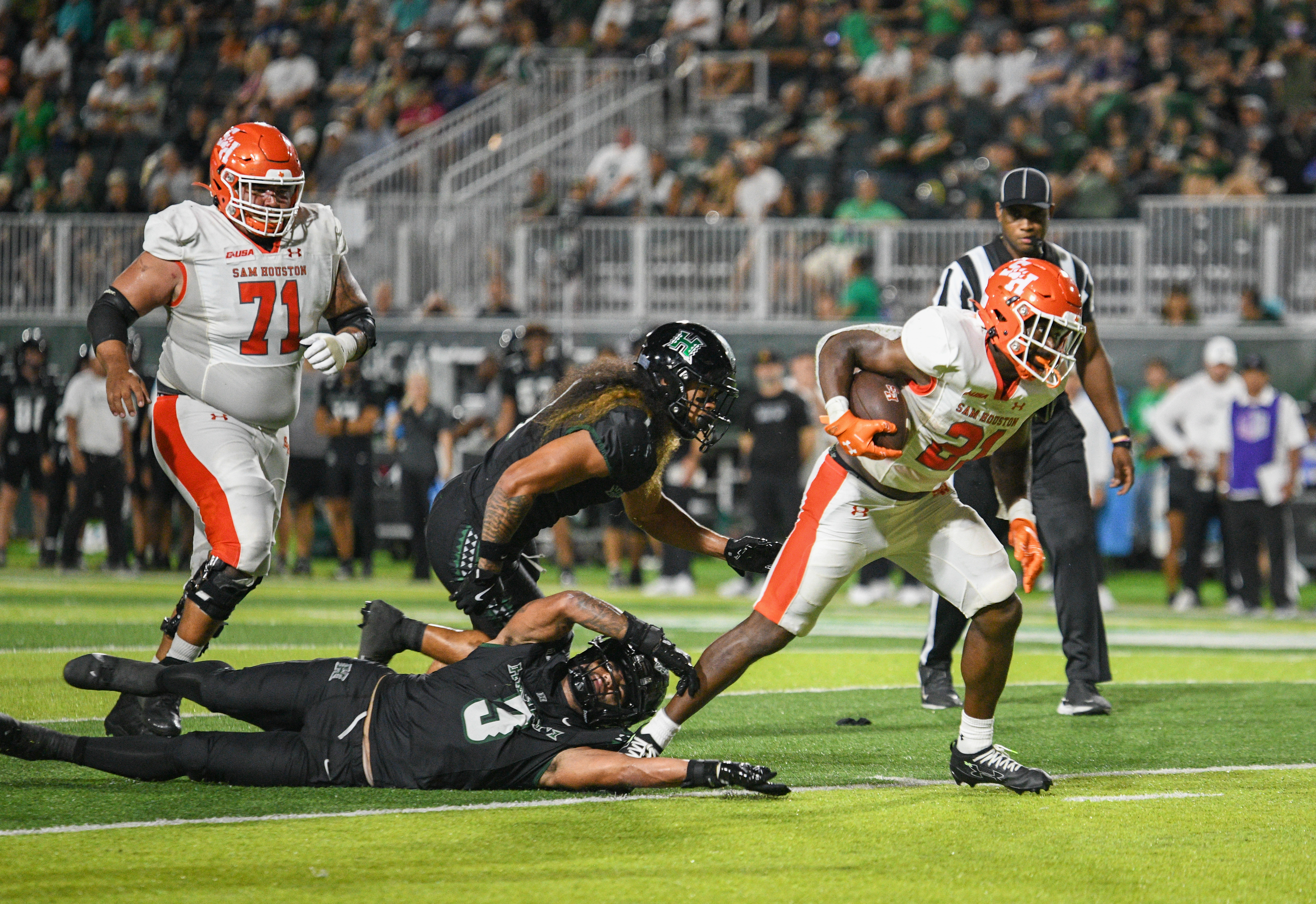 Elijah Green breaking a tackle in his Sam Houston State uniform