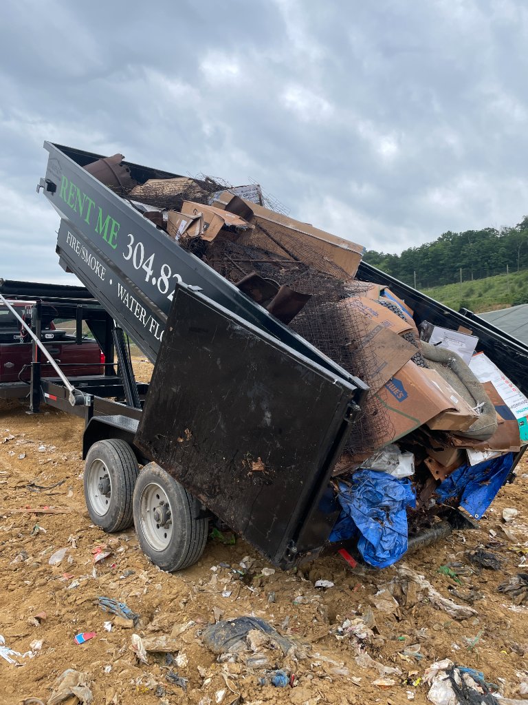 ZK dumpster being unloaded at facility