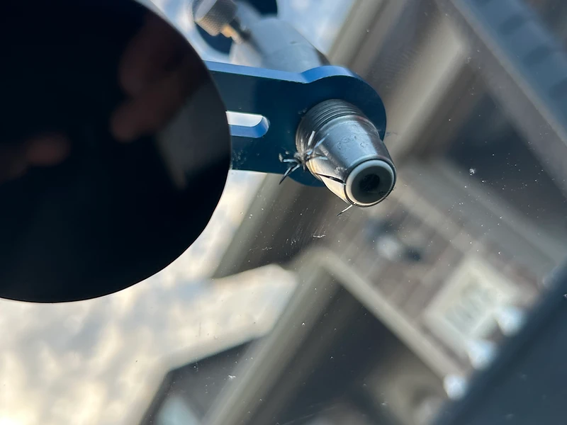 Precision windshield chip repair injector on glass