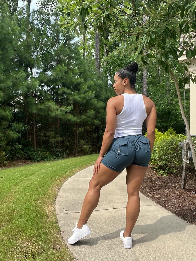 Physique coach LaToya Loren Price walking, built lower body and upright carriage