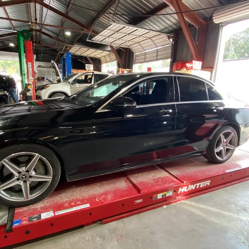 A car on the alignment rack at R&E Auto Repair
