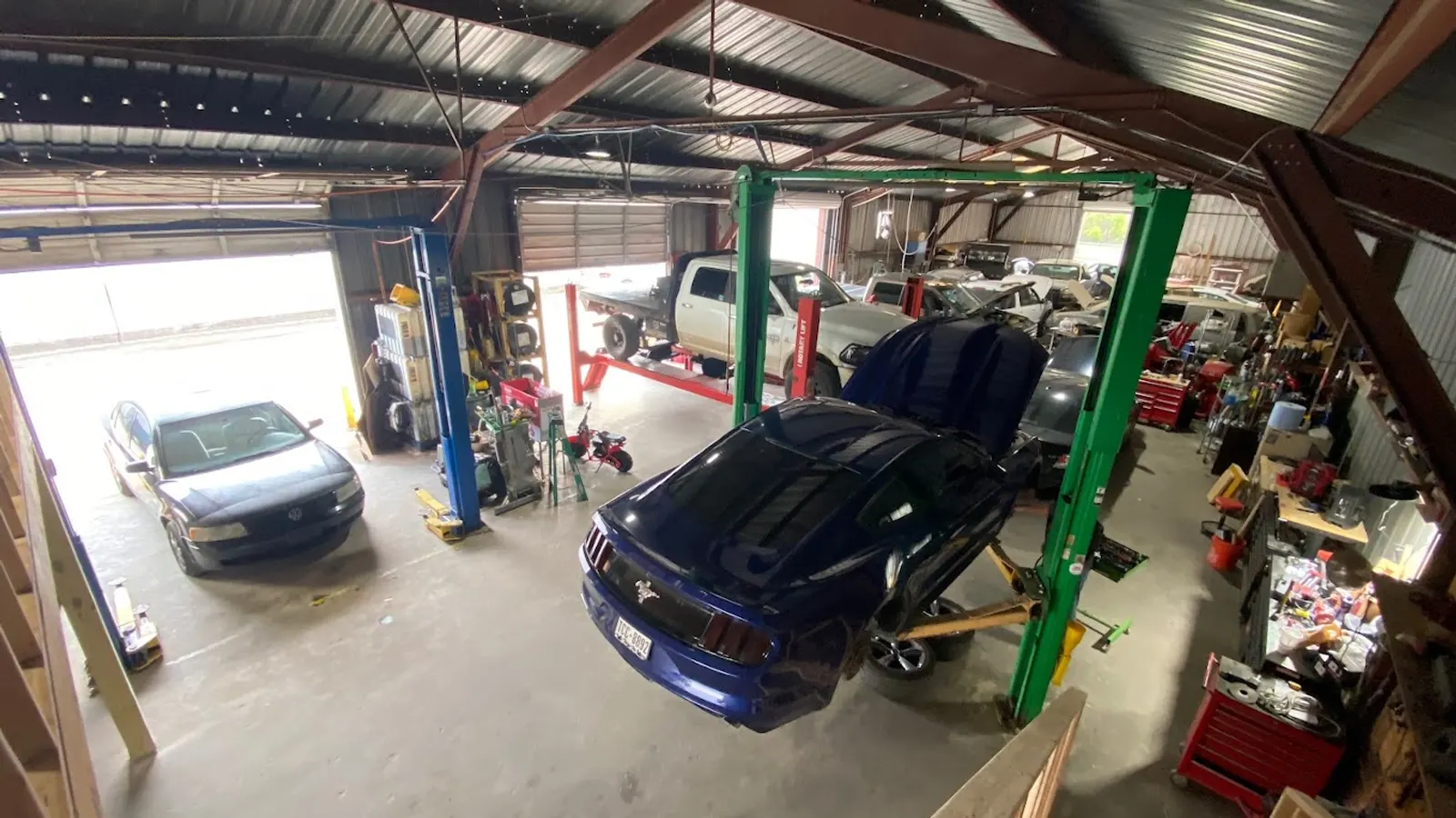 Inside R&E Auto Repair on Rayford Road: service bays and lifts