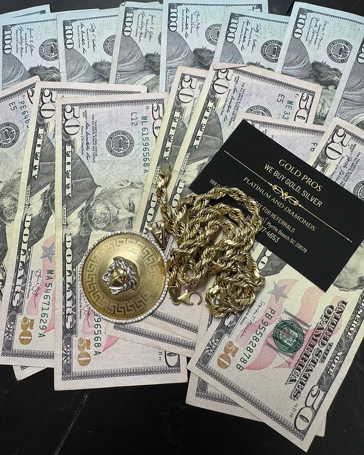 Gold Pros medusa pendant and chain displayed on currency — a curated pre-owned acquisition