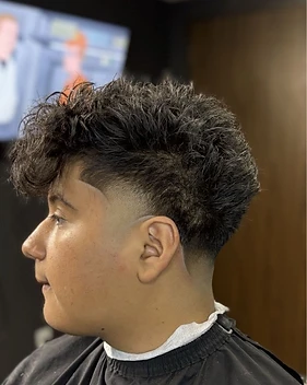 El Navajón haircut — low skin fade with curls