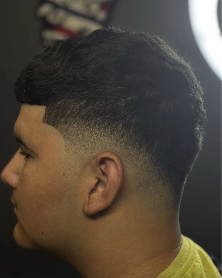 El Navajón haircut — skin fade, textured top