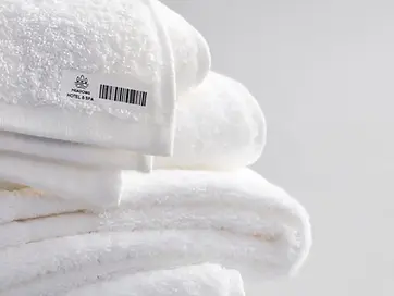 Branded label sewn onto hotel towels