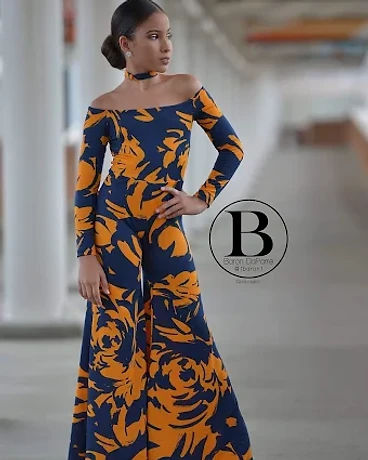 Model wearing a navy and marigold floral patterned jumpsuit