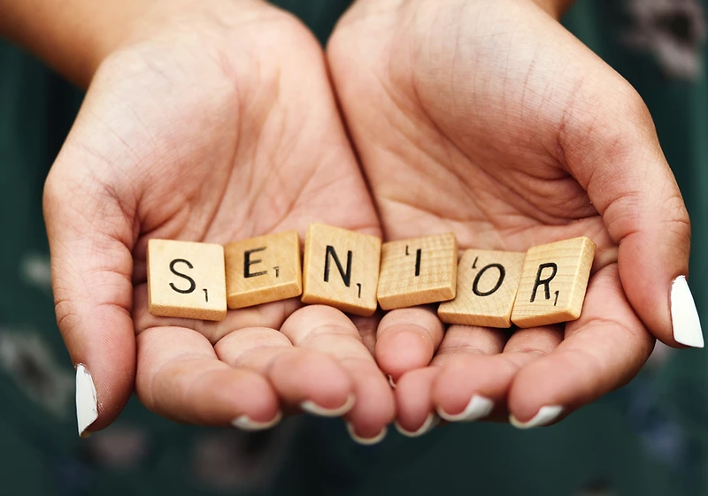 Caring hands supporting a senior at home