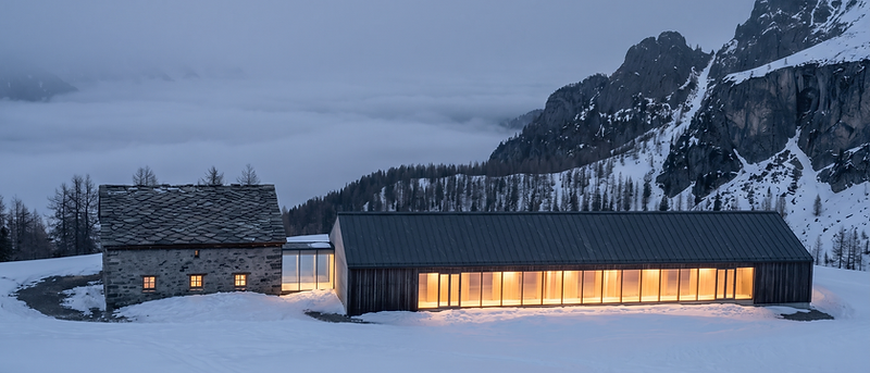 NÉVÉ wall of light — the Wing glowing against the snow