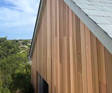 House gable clad in warm-toned vertical wood siding