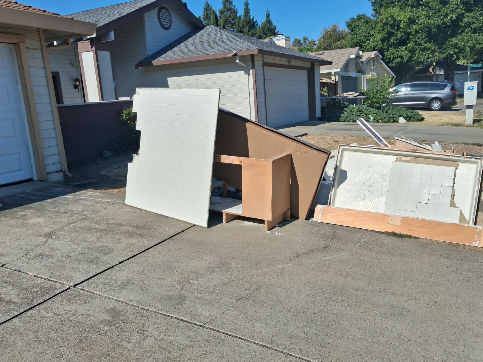 Full carpet removal — rolled and loaded onto the truck for haul-away.